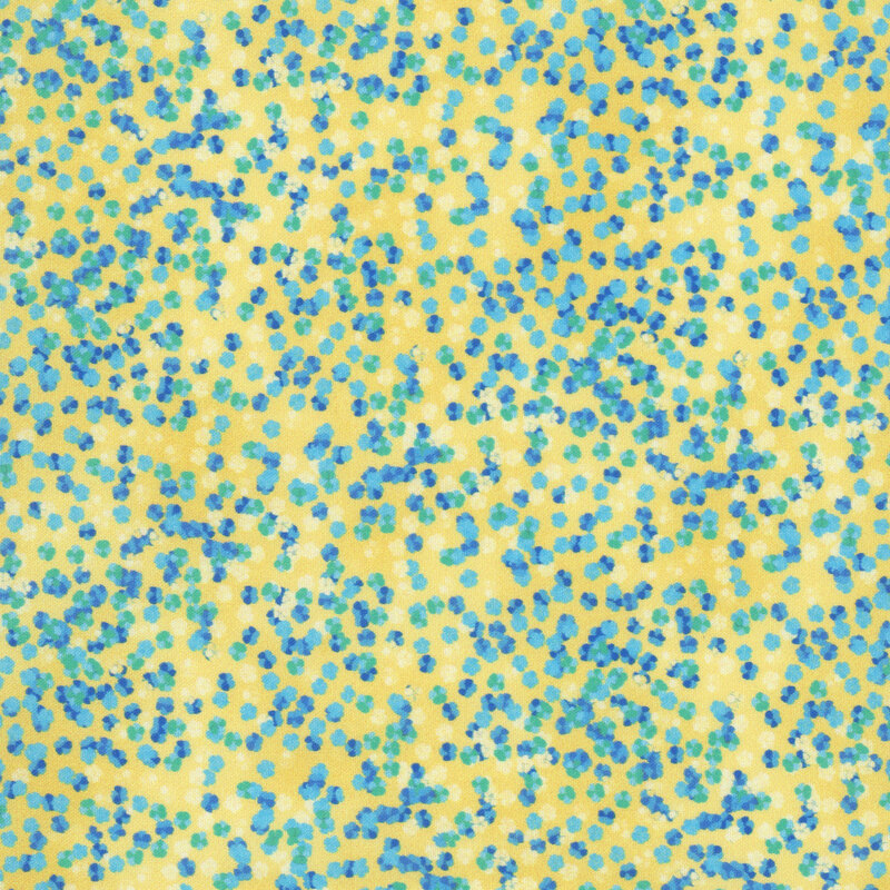 A textured yellow fabric with blue and teal bursts of color. 