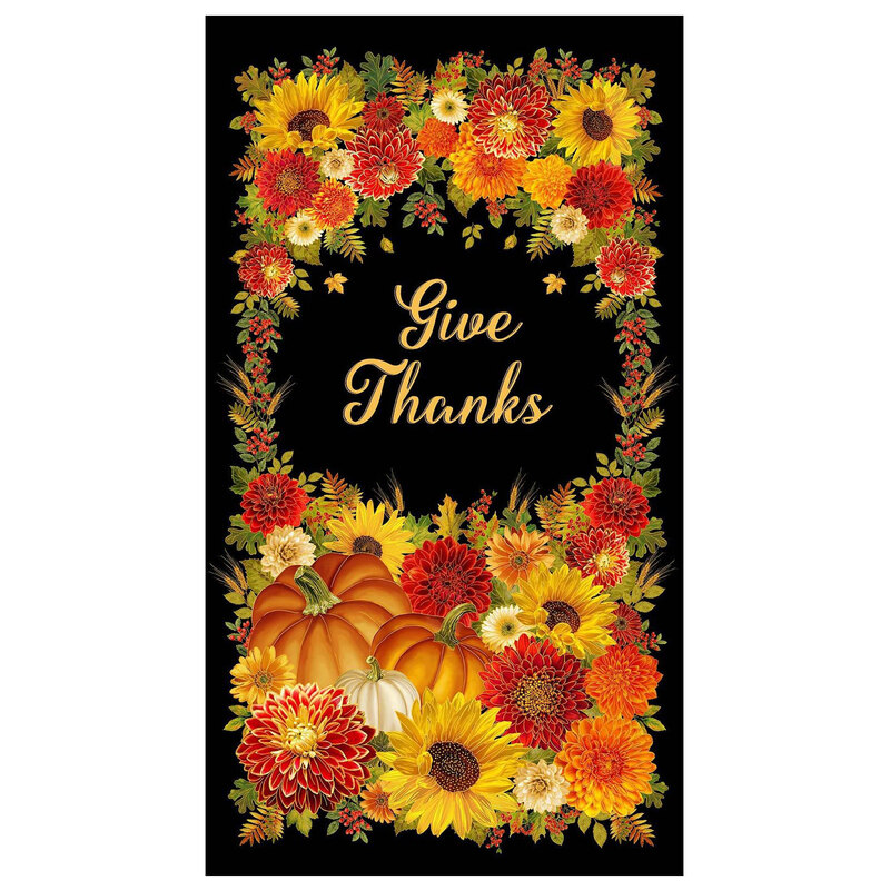 A black panel filled with fall foliage, pumpkins, and flowers with the words "Give Thanks" written in cursive in the center.  