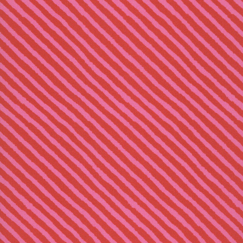 Pink and red diagonal, distressed striped fabric 