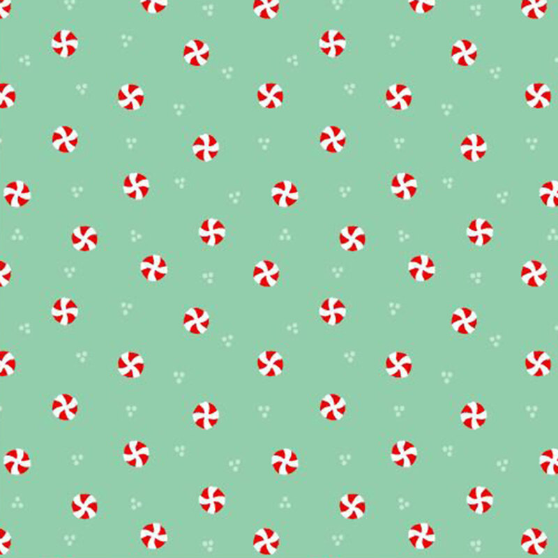 Mint green fabric with a ditsy pattern of white dots and red and white peppermints