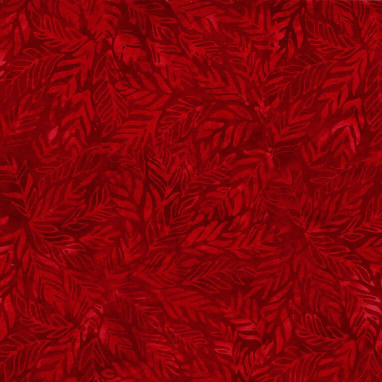 A tonal bright red batik fabric with leaves.