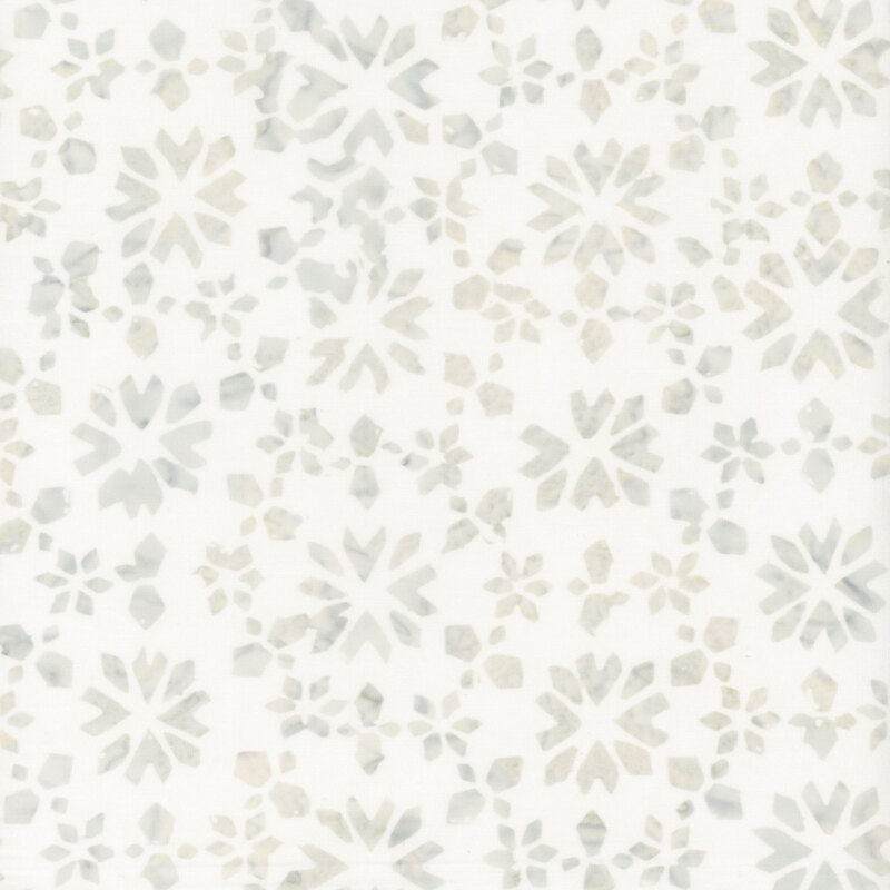 A white batik fabric with abstract gray geometric snowflakes. 