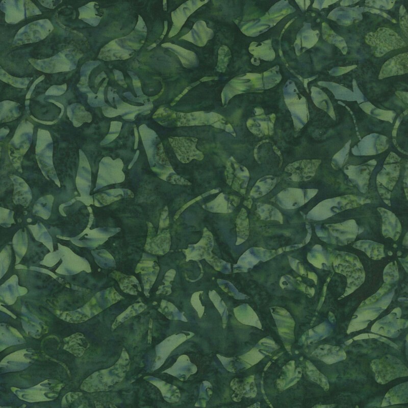 A tonal verdant batik fabric with swirling vines and leaves. 