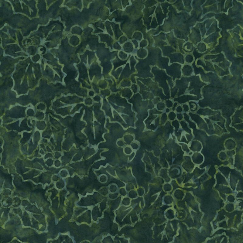 A green batik fabric with holly leaves and drupes. 
