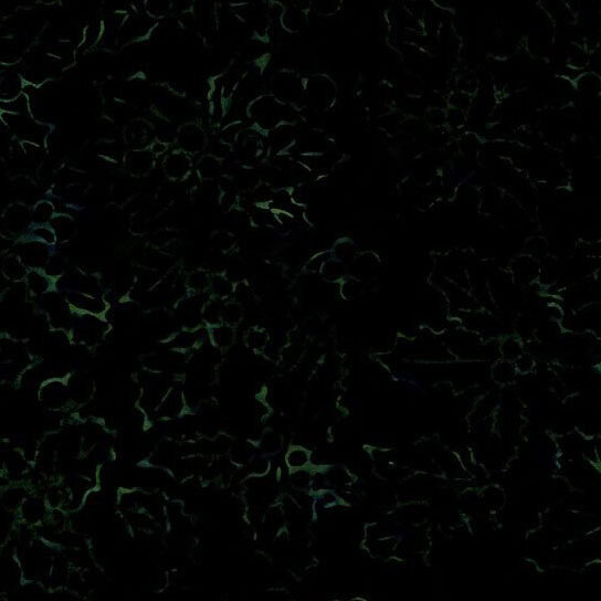 A tonal very dark green batik fabric with holly leaves and berries.