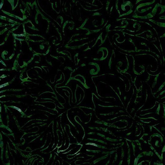 A very dark green batik fabric with green monstera leaves.
