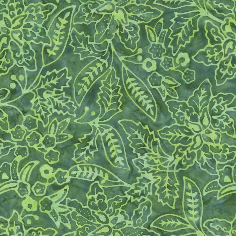 A forest green batik fabric with light green botanical motifs. 