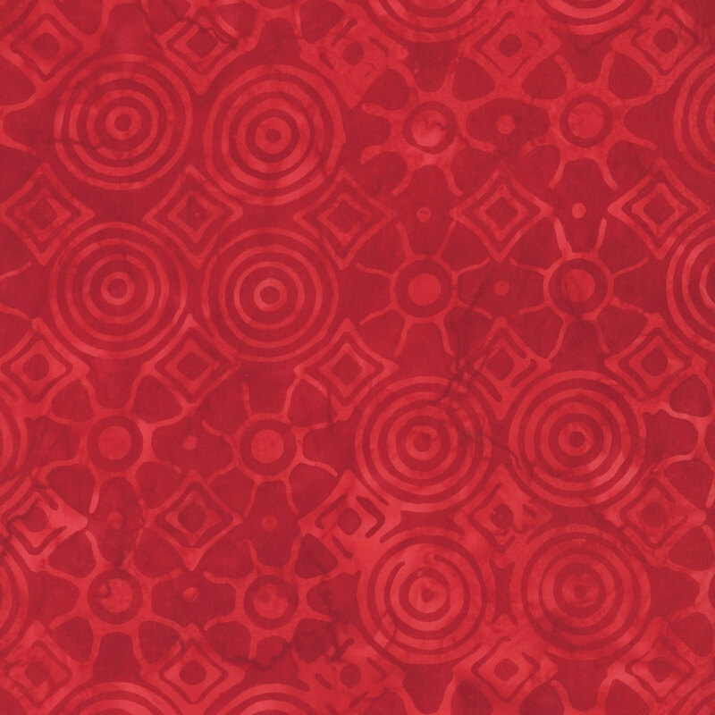 Bright red fabric featuring tonal circles and diamonds in rippling patterns from their centers.