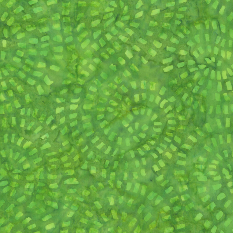 Mottled, grass green fabric featuring tonal blocks in swirling designs.
