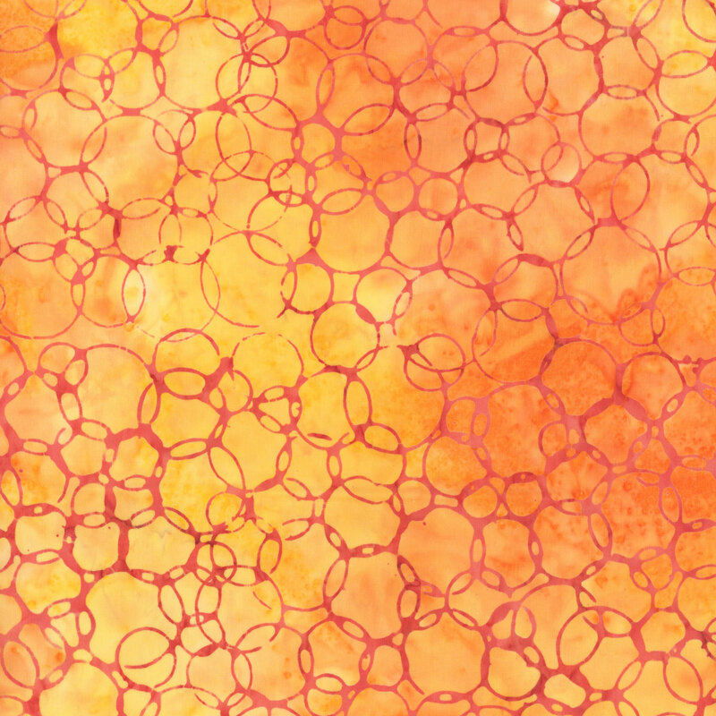 Mottled, bright orange fabric featuring overlapping circles like bubbling lava.
