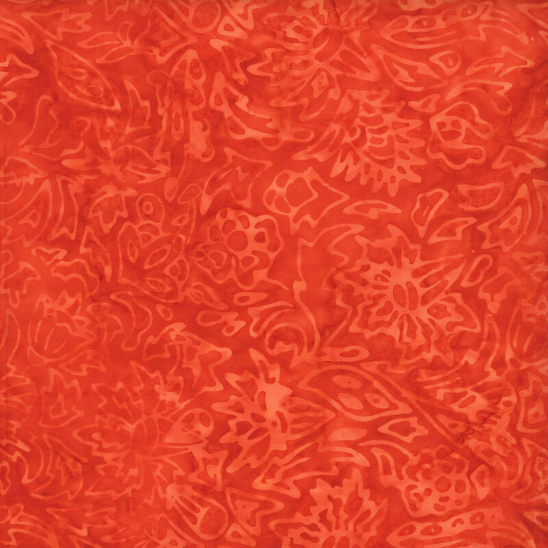 Bright orange watercolor fabric featuring a lightly stamped floral design.