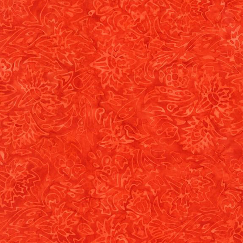 Bright orange watercolor fabric featuring a lightly stamped floral design.