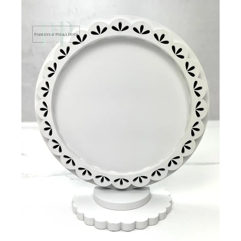 The fully assembled and painted Round Wood Décor Frame - Teardrop, staged on a white tabletop.