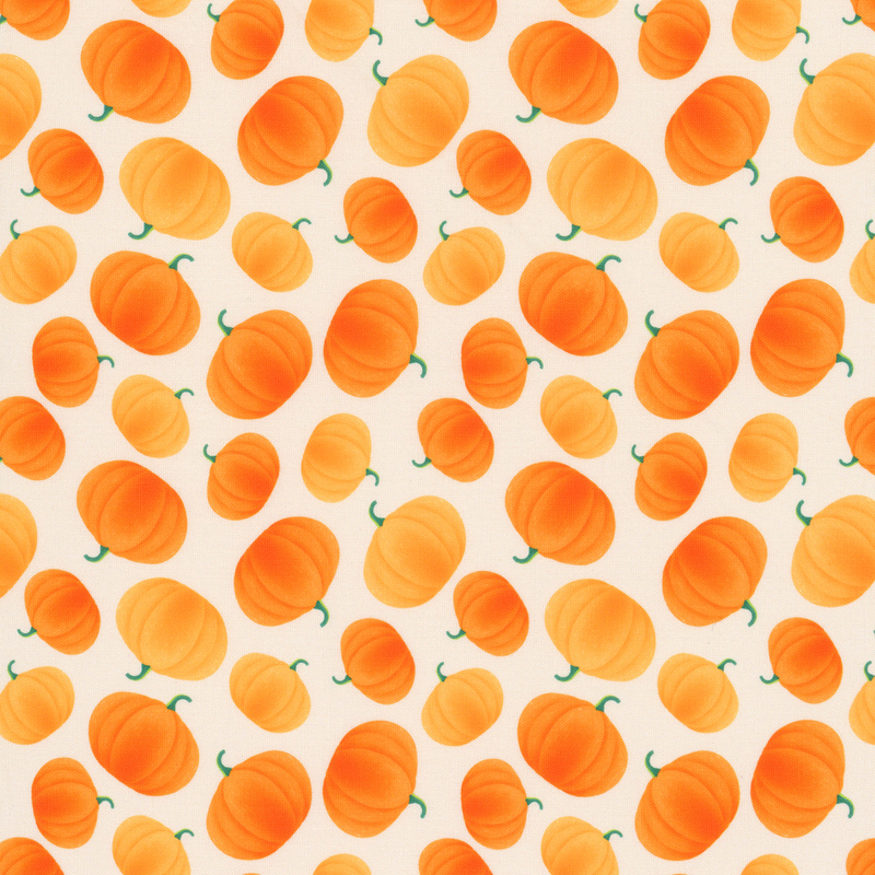Taupe fabric with a tossed pattern of shaded orange pumpkins