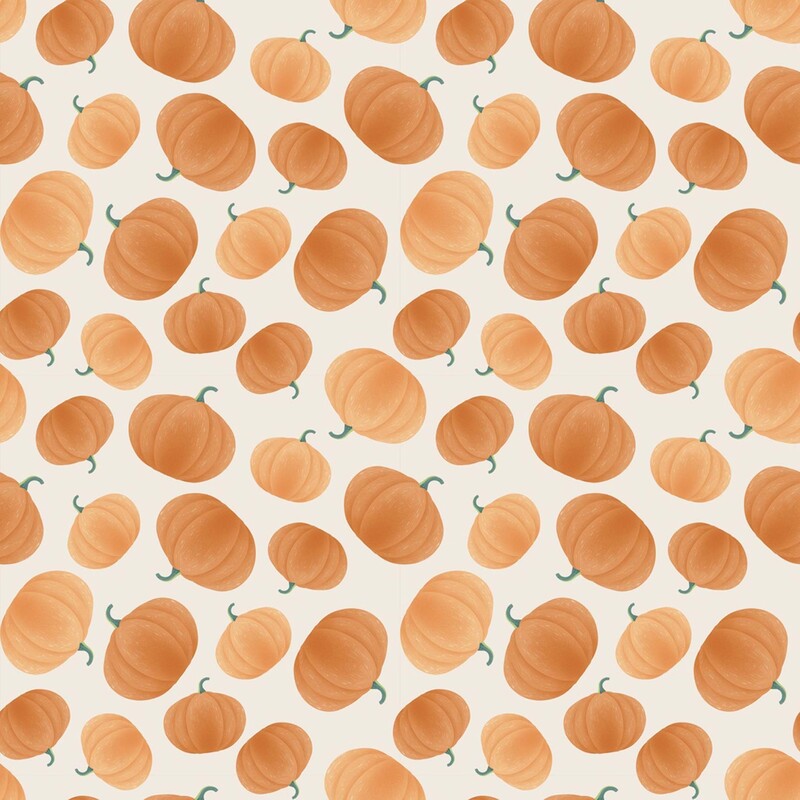 Taupe fabric with a tossed pattern of shaded orange pumpkins