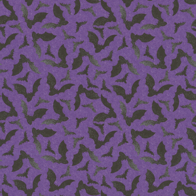 Aubergine fabric with a tossed pattern of textured black bats flapping their wings 
