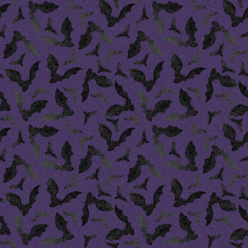 Aubergine fabric with a tossed pattern of textured black bats flapping their wings