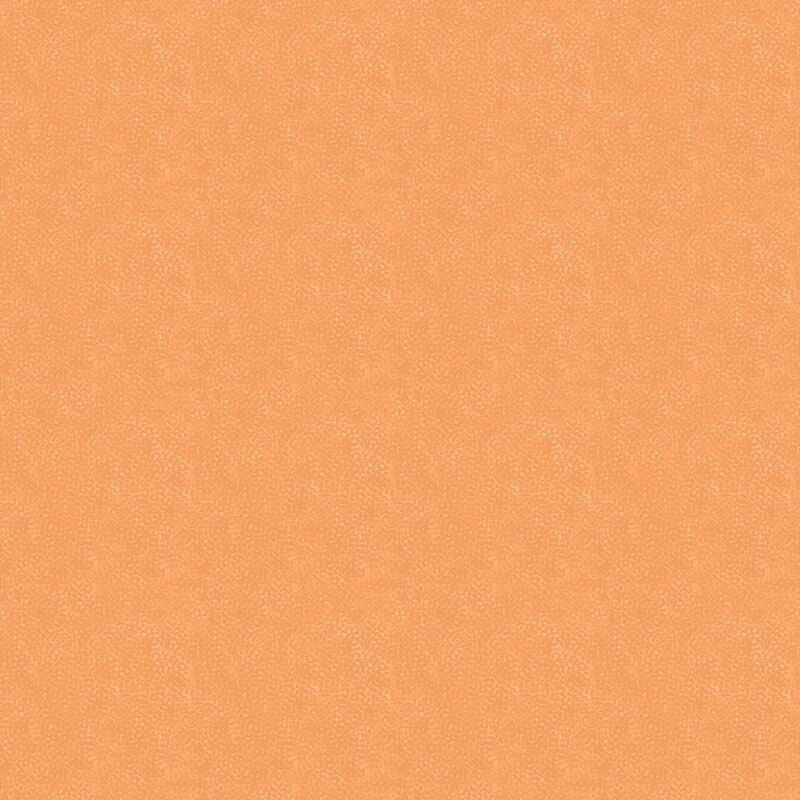 Textured and mottled pastel orange fabric