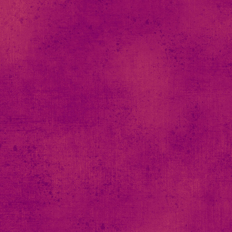 Magenta fabric with a subtle grunge texture.