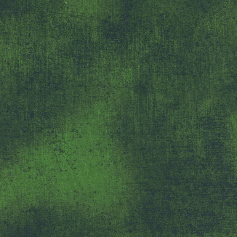 Dark green fabric with a subtle grunge texture.