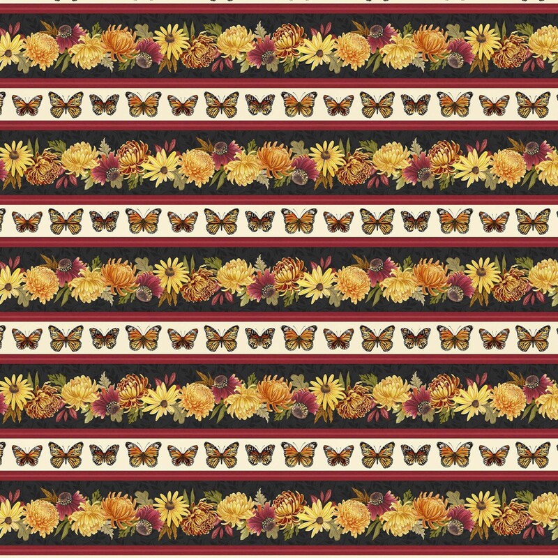 Border print fabric with strips of black with orange and yellow florals, red stripes, and cream stripes with monarch butterflies