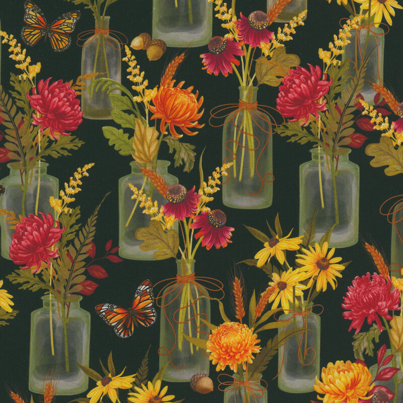 Black fabric with a pattern of glass vases with bouquets containing yellow and red chrysanthemums, yellow daisies, wheat, and ferns along with monarch butterflies and acorns