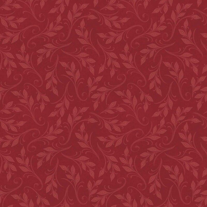 Crimson fabric with swirling, tonal leafy vines