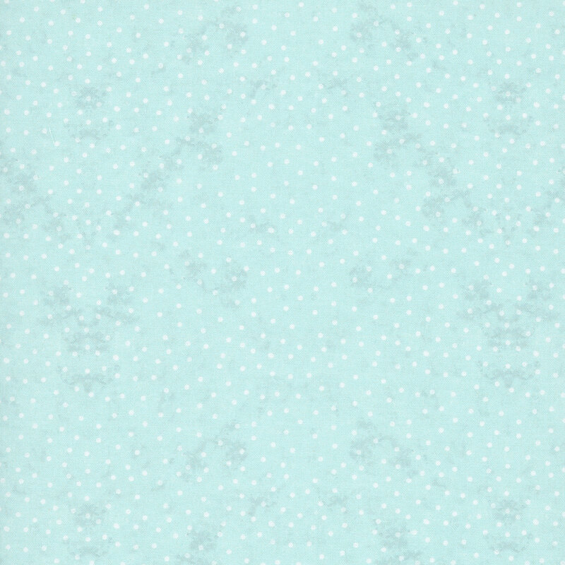 White polka dots on mottled ice blue fabric.