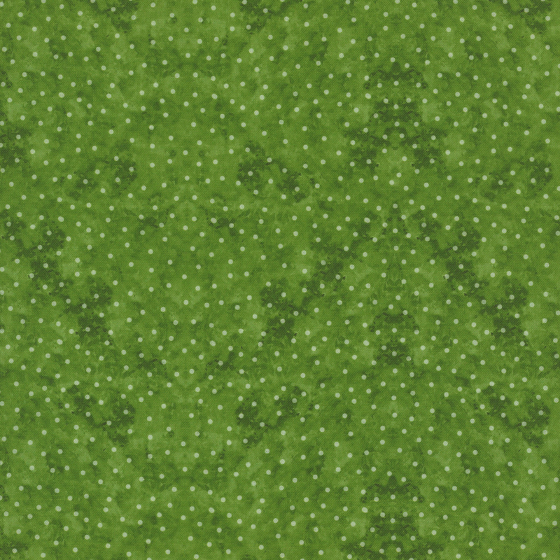 White polka dots on mottled green fabric.