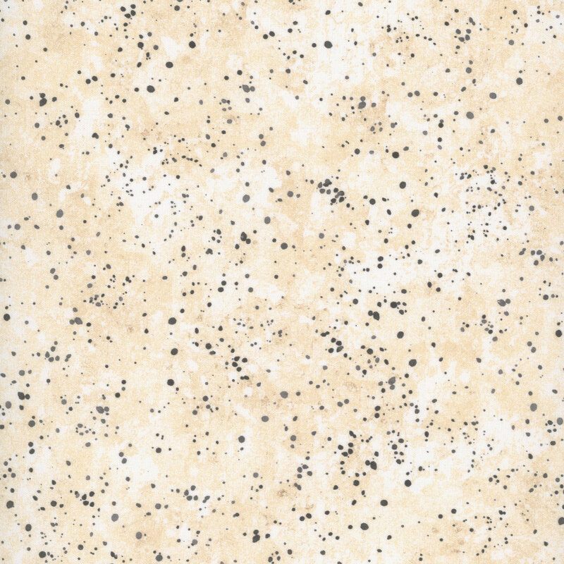 Mottled cream fabric featuring spots resembling paint splatter of black and cool gray.