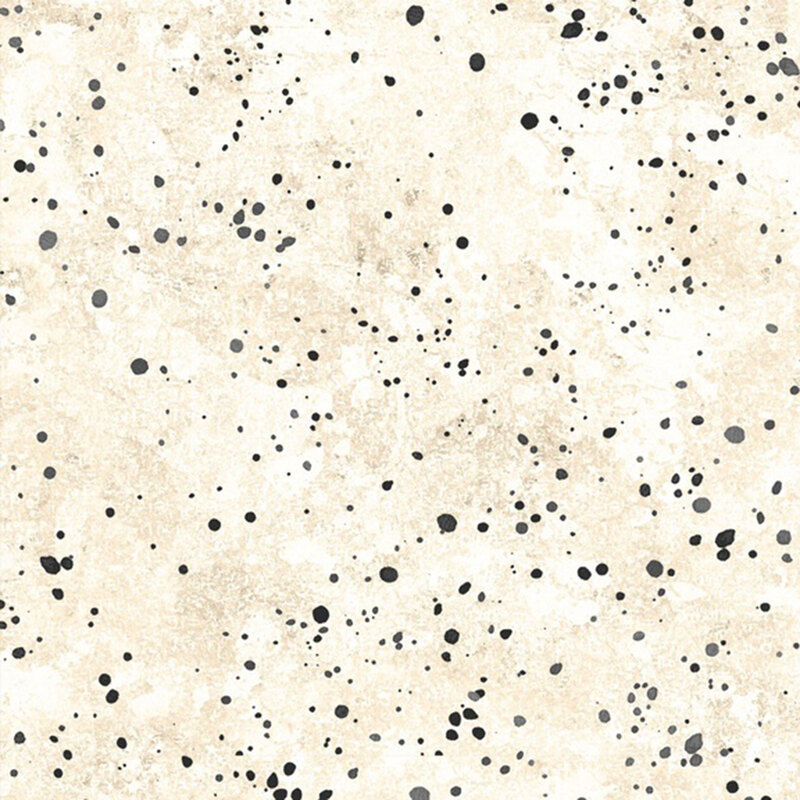 Mottled cream fabric featuring spots resembling paint splatter of black and cool gray.
