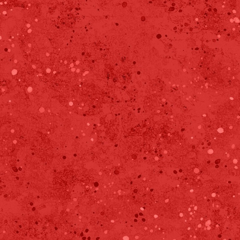 Mottled red fabric featuring tonal spots resembling paint splatter.