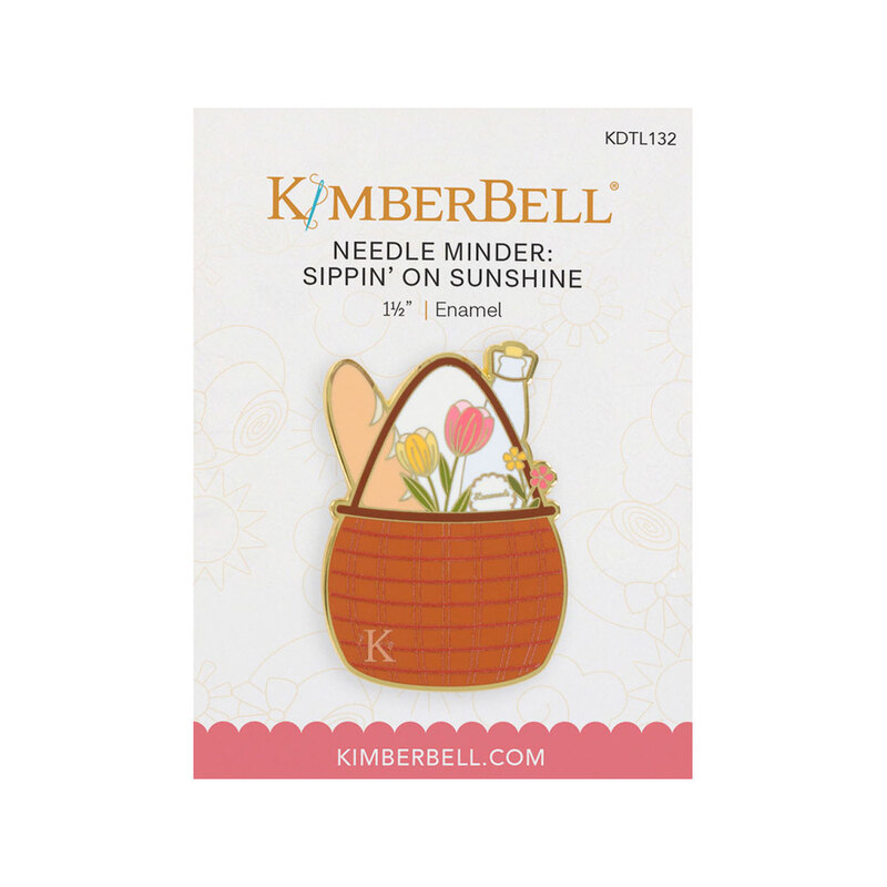 Front image of the Kimberbell Sippin' On Sunshine needle minder featuring a basket with tulips, bread, and a glass jar.