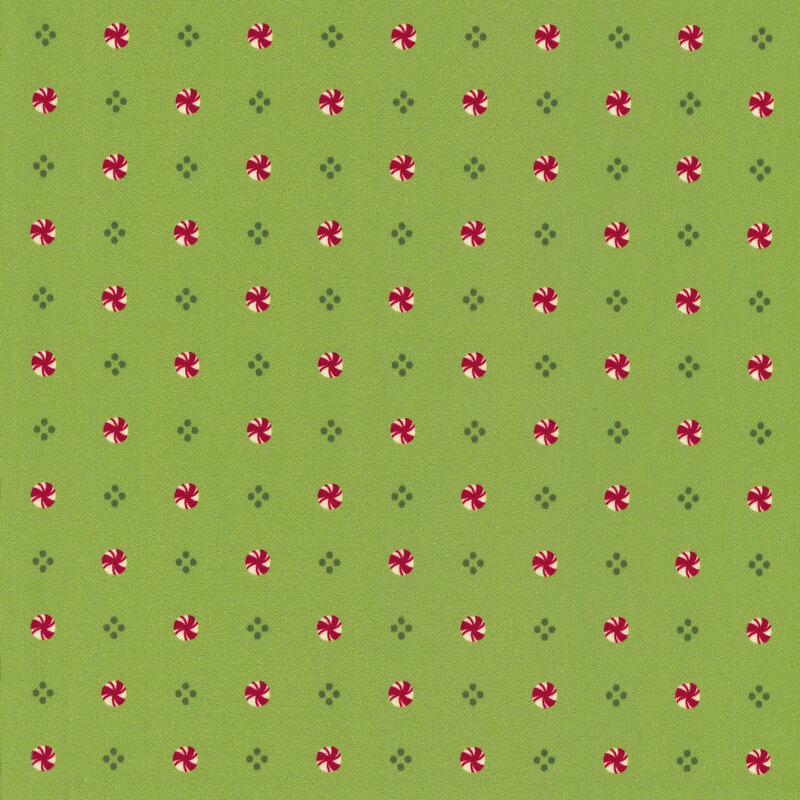 Sage green fabric with an evenly spaced pattern of diamond shapes and peppermints.