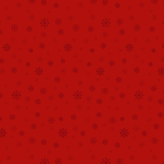 Red fabric with a delicate pattern of varying snowflake sizes.