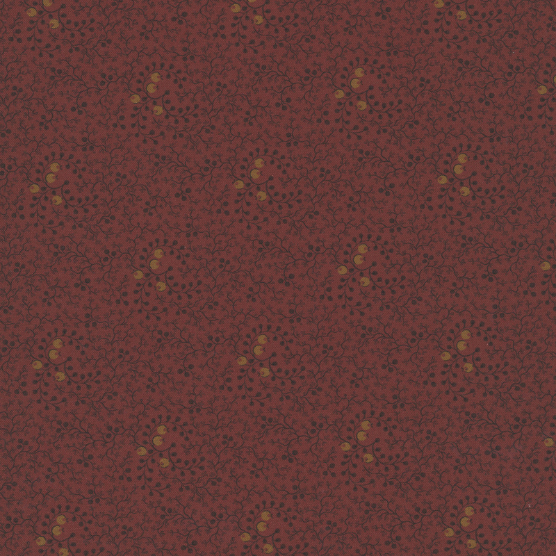 Cranberry red fabric with a pattern of black vines and gold circles