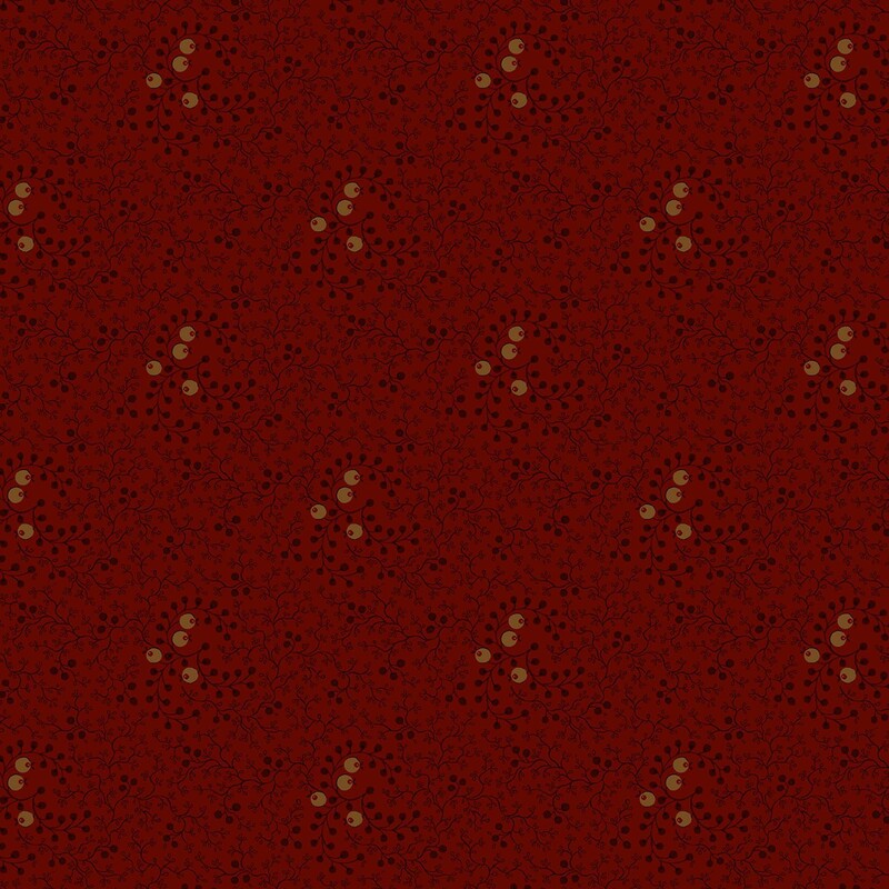 Cranberry red fabric with a pattern of black vines and gold circles