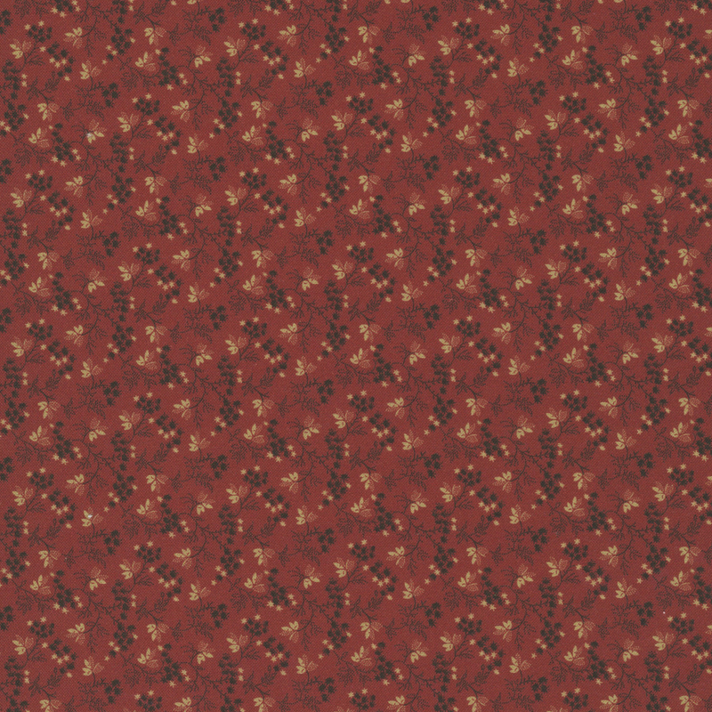 Deep red fabric with primitive pattern of taupe florals and black leaves