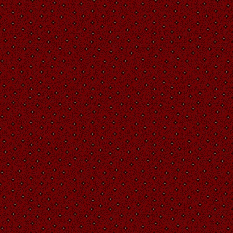 Brick red fabric with a primitive pattern of black and taupe florals and black vines