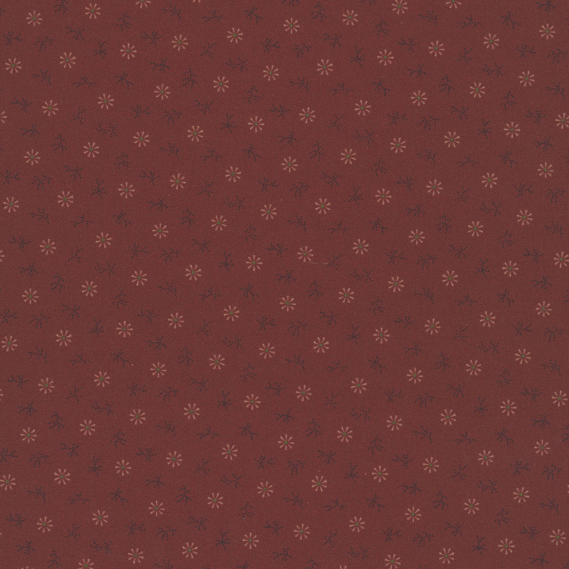 Maroon fabric with cream geometric snowflakes and black dots