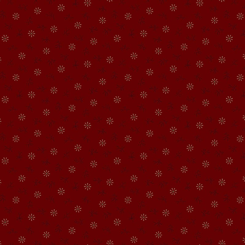 Maroon fabric with cream geometric snowflakes and black dots