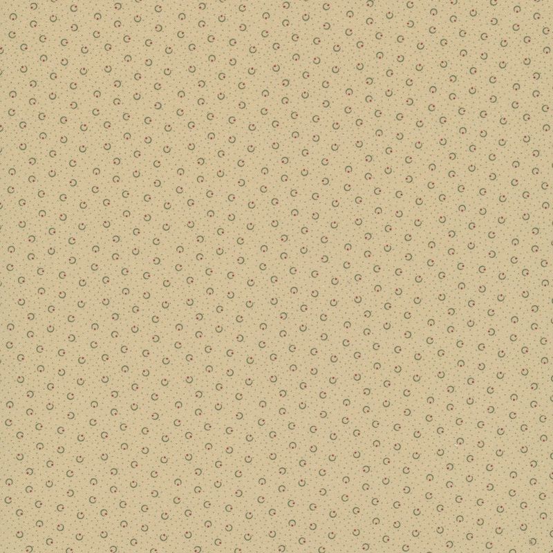 Buff beige fabric with black pin dots and crescent shapes with red stars