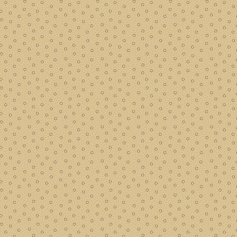 Buff beige fabric with black pin dots and crescent shapes with red stars