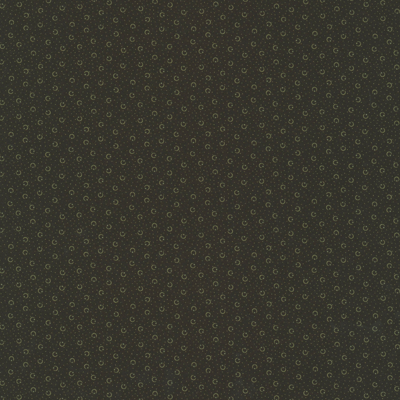 Black fabric with taupe pin dots and crescent shapes with stars