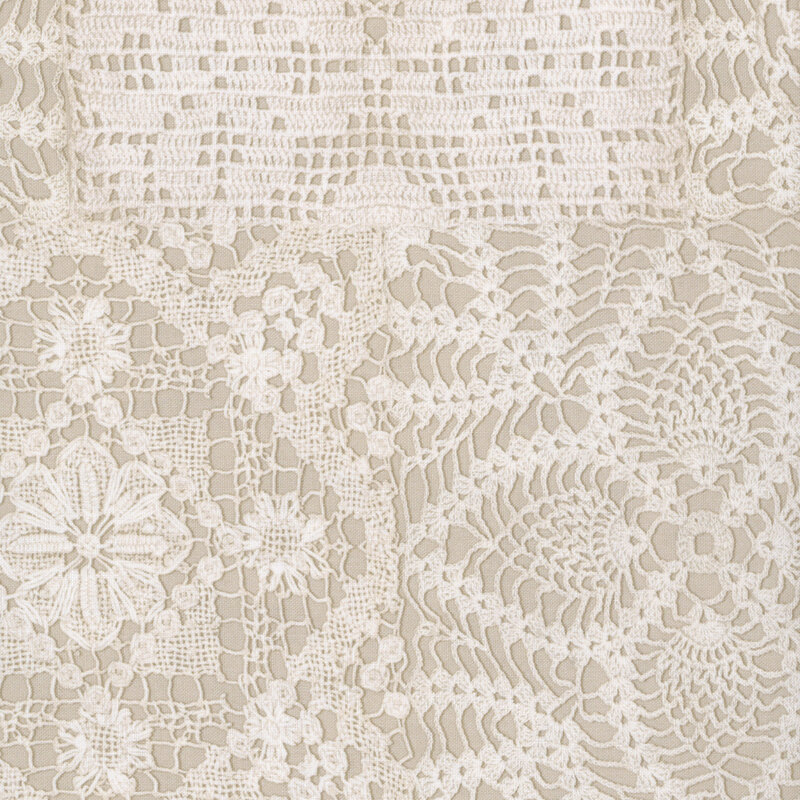 Tan fabric with a printed ornamental crochet lace pattern.