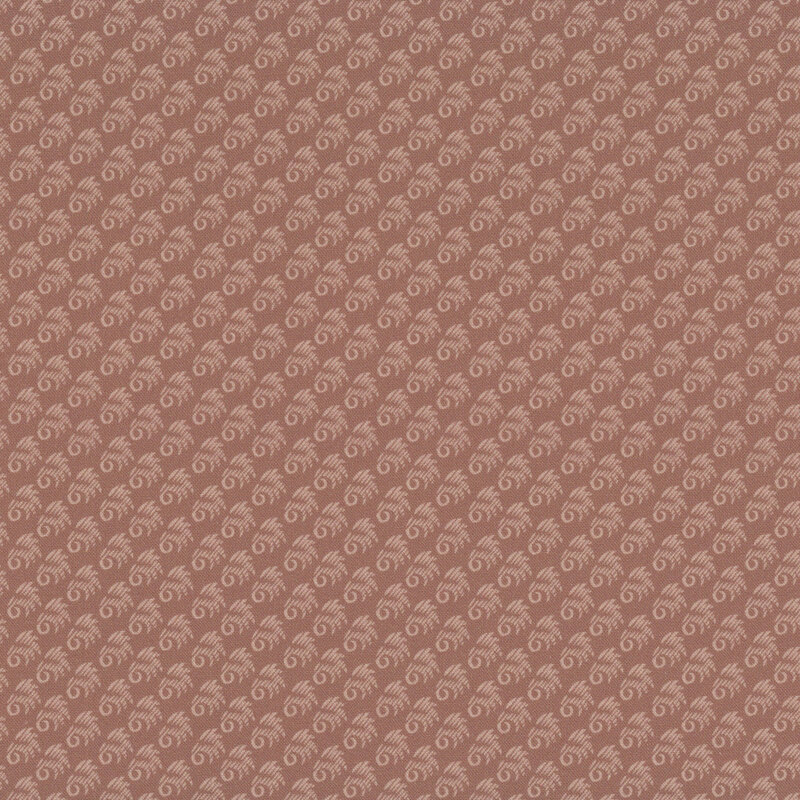 Dark rose fabric with an abstract, primitive pattern of evenly spaced tonal motifs.