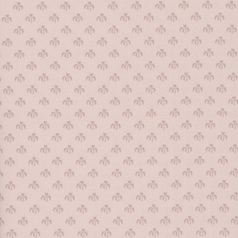 Dusty pink fabric with an evenly spaced pattern of tonal, stylized floral designs.