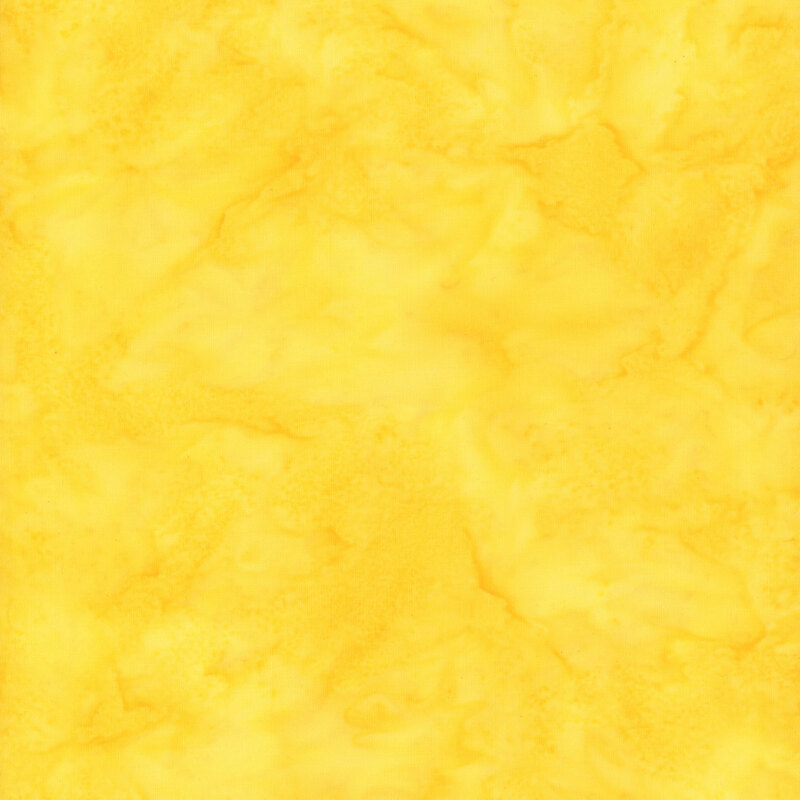 Mottled bright yellow tonal batik fabric