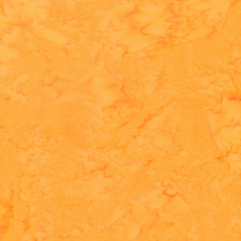 Mottled bright orange tonal batik fabric