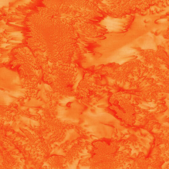 Mottled bright orange tonal batik fabric